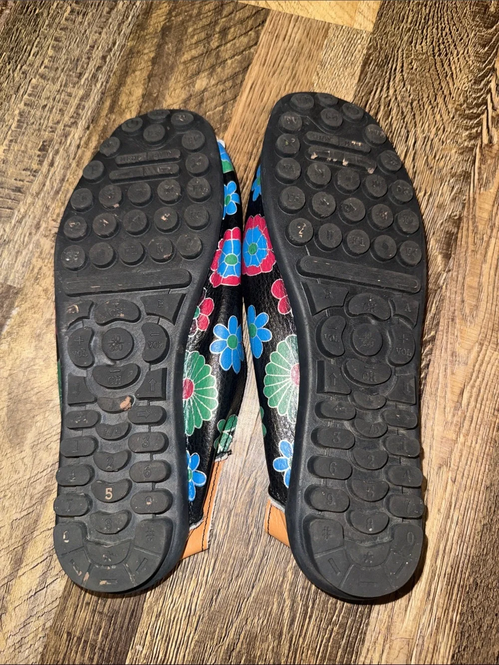 Black Leather Floral Slip-On Flats with Tan Accents